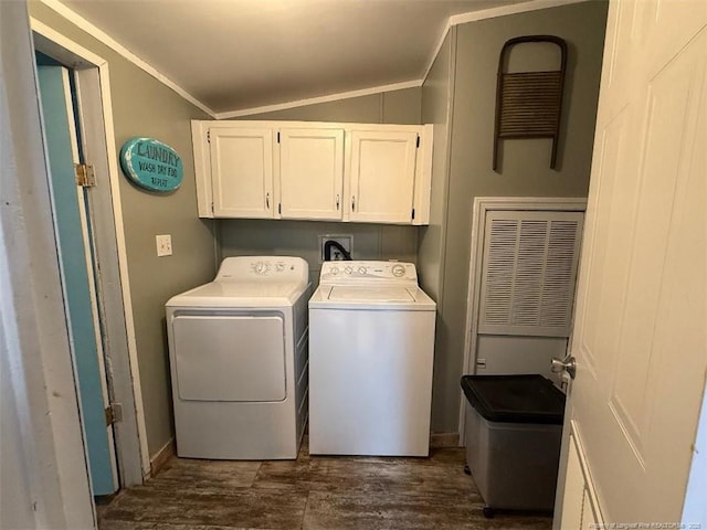 laundry area with cabinets, ornamental molding, dark hardwood / wood-style floors, and washer and dryer