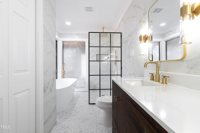 full bathroom featuring crown molding, tile walls, a soaking tub, toilet, and vanity