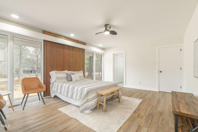 bedroom featuring light wood-style floors, recessed lighting, ceiling fan, and baseboards