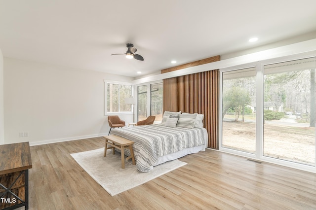 bedroom featuring baseboards, visible vents, wood finished floors, access to exterior, and recessed lighting