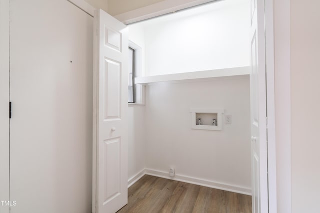 washroom with laundry area, hookup for a washing machine, baseboards, and wood finished floors