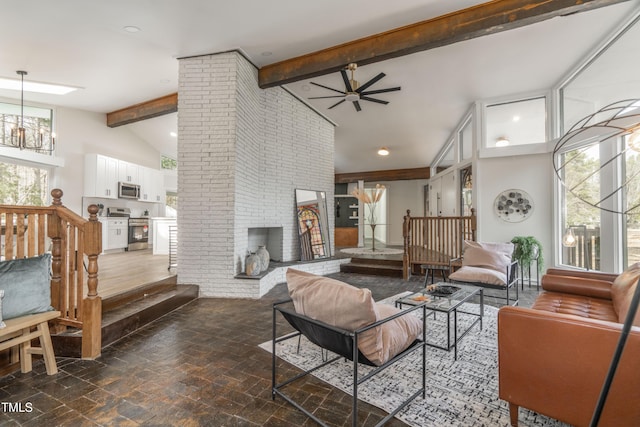 living area featuring high vaulted ceiling, recessed lighting, ceiling fan with notable chandelier, a fireplace, and beam ceiling