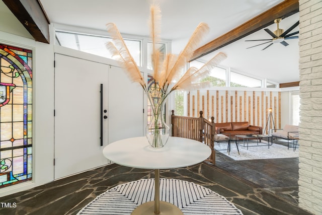 dining room with vaulted ceiling with beams