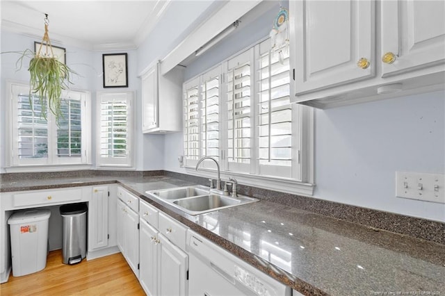 kitchen featuring white cabinetry, sink, ornamental molding, white dishwasher, and light wood-type flooring