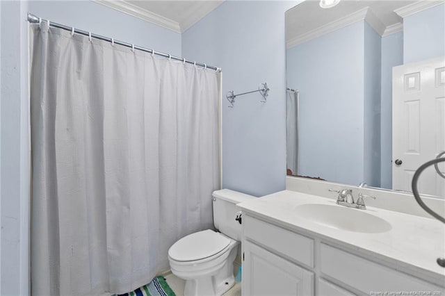 bathroom with vanity, ornamental molding, and toilet