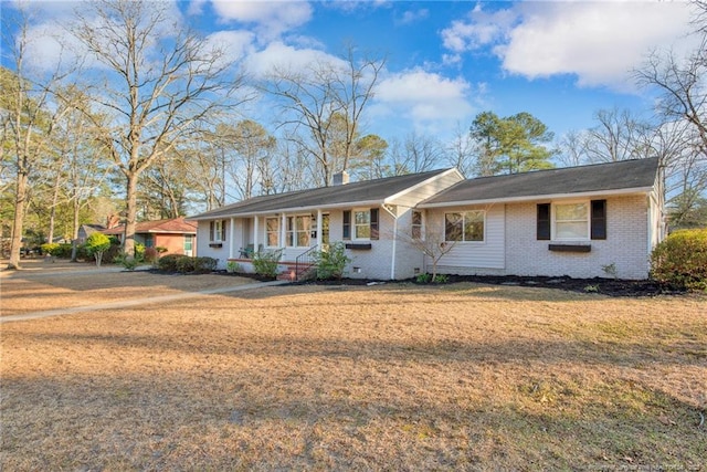 ranch-style house with a front lawn