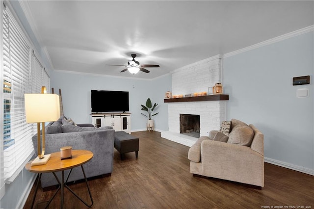 living room featuring dark hardwood / wood-style flooring, crown molding, a fireplace, and ceiling fan