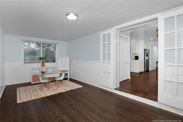 sitting room featuring dark wood-type flooring