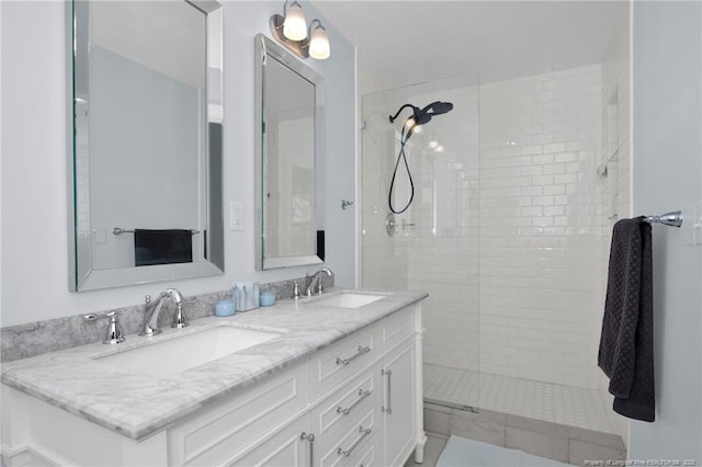 bathroom featuring vanity and a tile shower