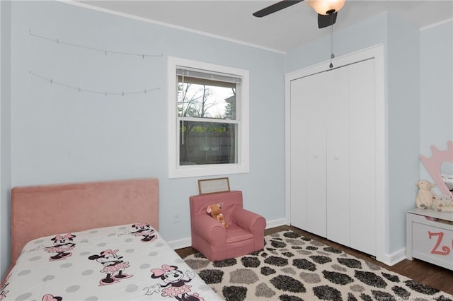 bedroom featuring dark wood-type flooring and ceiling fan