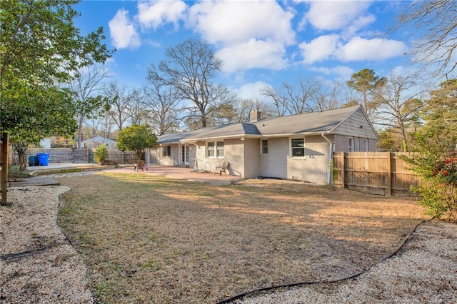 rear view of property with a patio