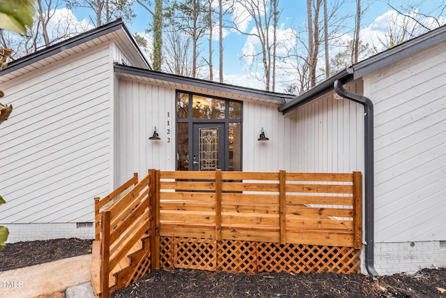 doorway to property with a deck