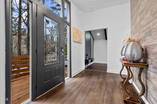 entrance foyer with dark hardwood / wood-style floors