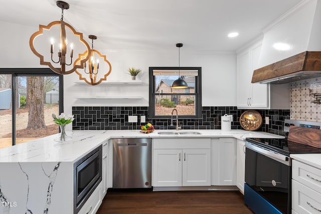 kitchen with stainless steel appliances, custom range hood, sink, and white cabinets