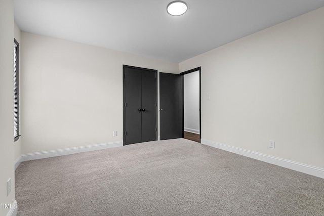 unfurnished bedroom featuring carpet floors