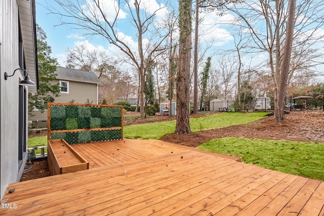 wooden terrace with a yard