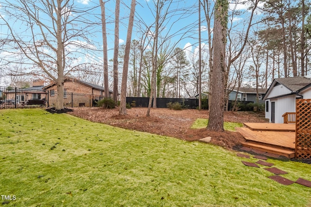 view of yard with a wooden deck