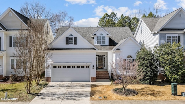 traditional-style home with concrete driveway and roof with shingles