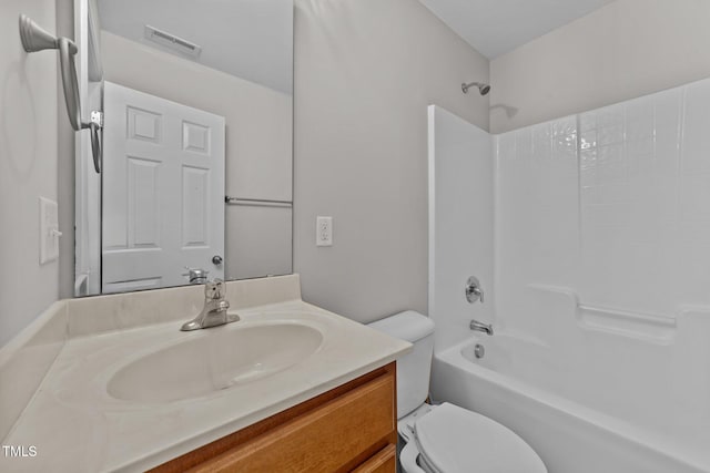 full bathroom featuring toilet, visible vents,  shower combination, and vanity