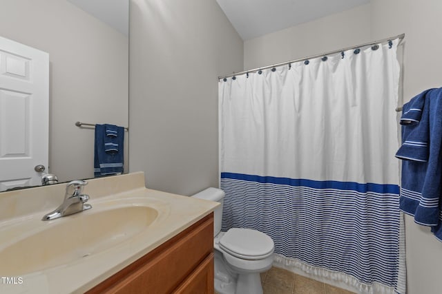 bathroom with curtained shower, vanity, toilet, and tile patterned floors