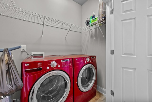 laundry room featuring washing machine and dryer