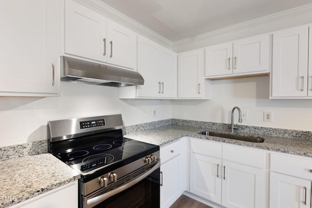 kitchen with light stone counters, stainless steel range with electric stovetop, sink, and white cabinets