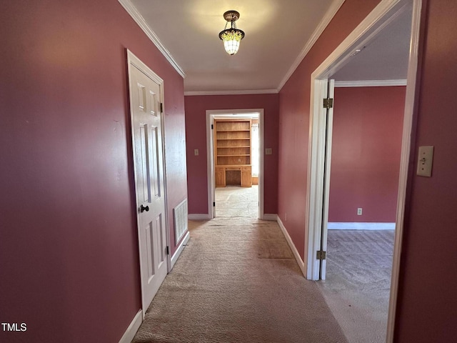 hallway featuring light carpet and ornamental molding