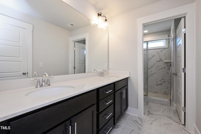 bathroom featuring vanity and a shower with door