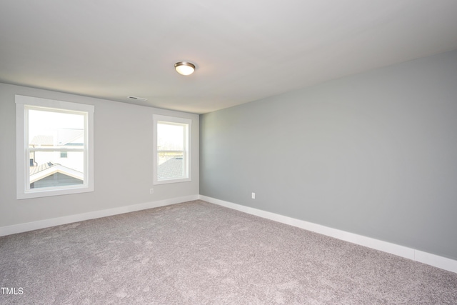 unfurnished room with carpet