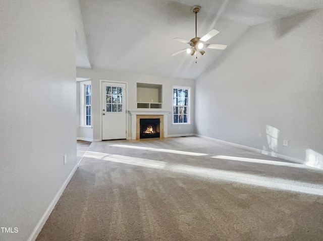 unfurnished living room featuring high vaulted ceiling, light carpet, and ceiling fan