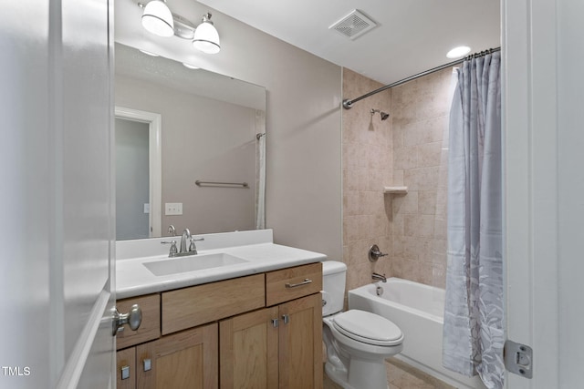 full bathroom with vanity, shower / tub combo with curtain, and toilet