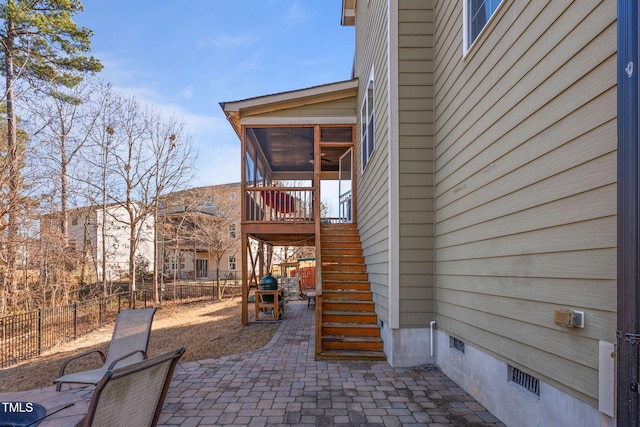 view of patio / terrace with a sunroom