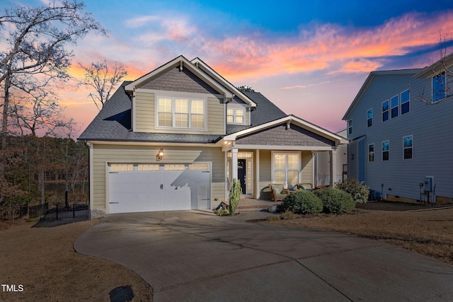 view of front of home with a garage and covered porch