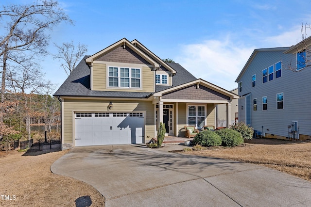 view of front of house with a garage and covered porch