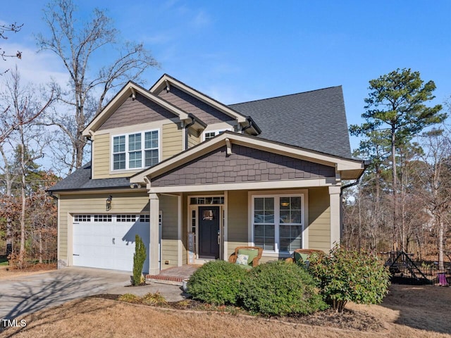 view of front of property featuring a garage and covered porch