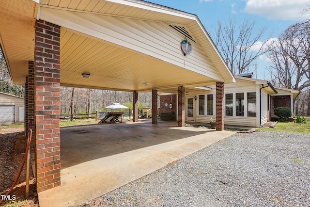 exterior space with an attached carport and driveway
