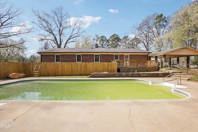 view of pool featuring a deck, a patio area, a fenced backyard, and a fenced in pool
