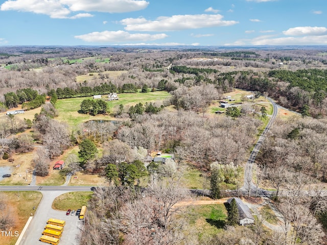 drone / aerial view featuring a view of trees