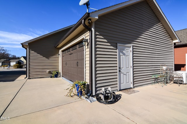 view of side of property with a garage