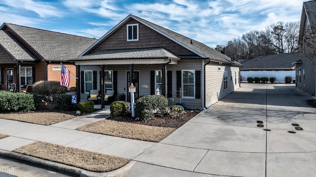 view of front of property featuring a porch and a garage