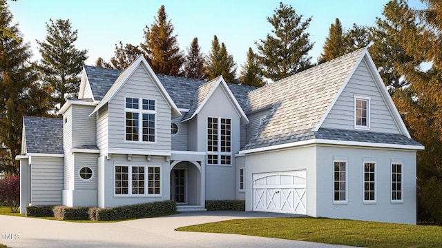 view of front of house with a garage and a front yard