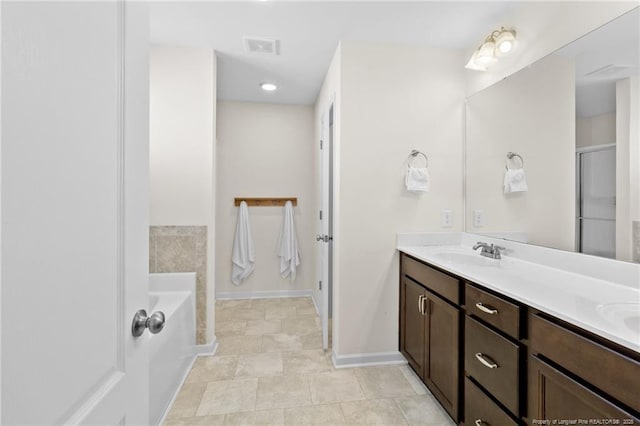 bathroom with vanity and a bathing tub