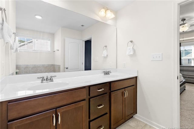 bathroom with vanity, a wealth of natural light, and ceiling fan