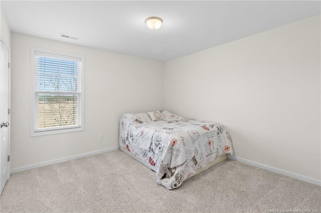 bedroom featuring light colored carpet