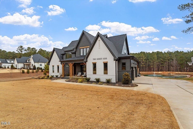 view of front facade featuring a garage and a front lawn