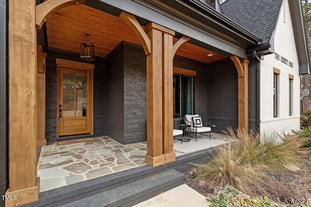 entrance to property featuring covered porch