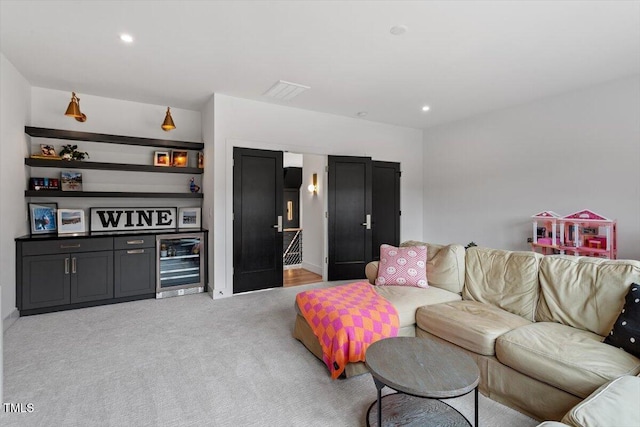 living room with light colored carpet and beverage cooler