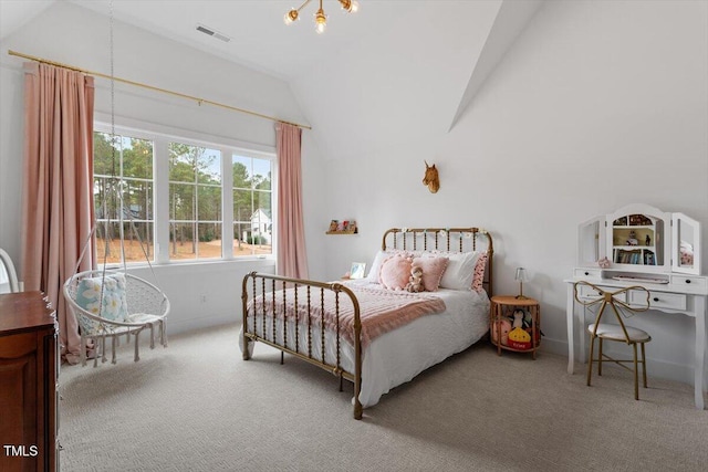 carpeted bedroom with lofted ceiling