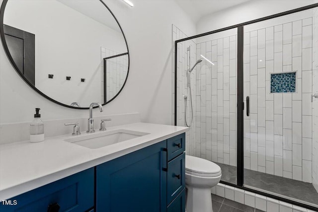 bathroom with vanity, toilet, an enclosed shower, and tile patterned flooring