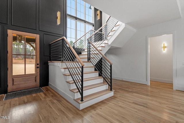 stairway featuring hardwood / wood-style floors